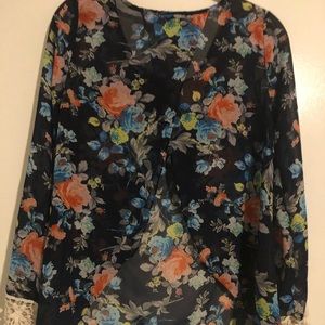 Long sleeve, lace cuff see-through flower top.